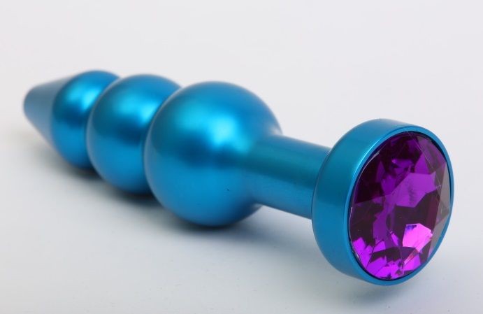 Синяя фигурная анальная пробка с фиолетовым кристаллом - 11,2 см.